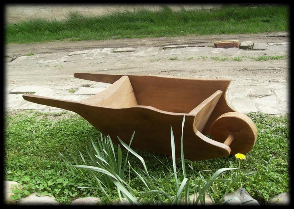 Wheel flower Have you ever seen wheelbarrow full of flowers? Add charm to your garden with this wood wheelbarrow planter.