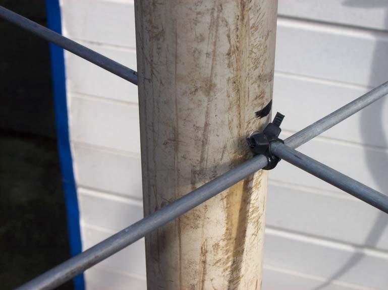 reflector. Both metal bars are held together using two cable ties, tied crosswise.