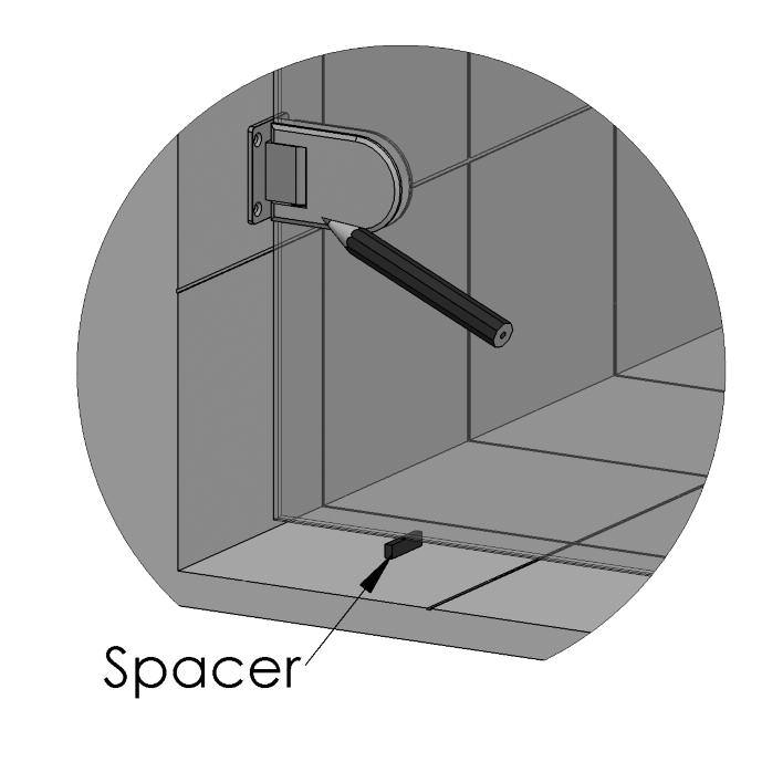 5. Offer the door into position and place the 2 spacers between the bottom of the glass and the floor, make sure the spacers are the correct way up i.e. 10mm gap between glass and floor.
