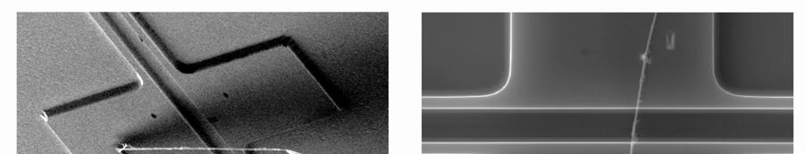 sample (a) atop of lacy carbon membrane, (b) attached to the tungsten microprobe using a platinum-based deposit, (c) approaching the fixture span, and (d) resting across the device fixture gap.