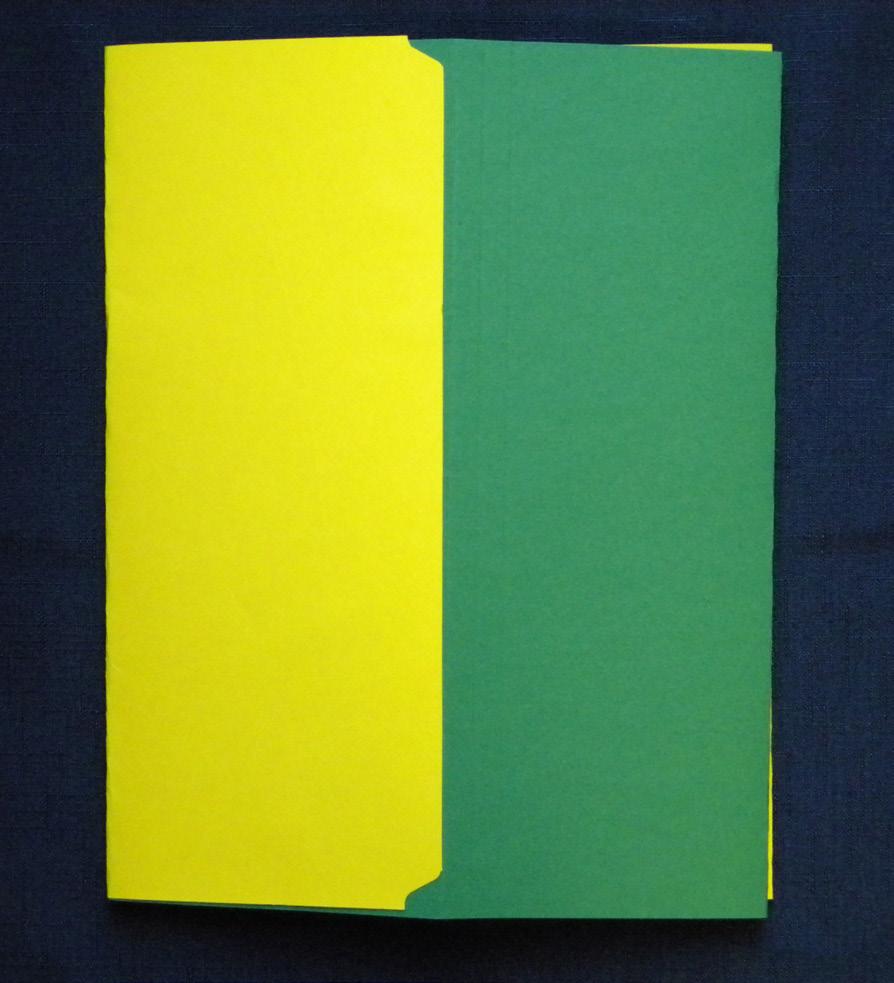 Now, run tape along the right edge of the closed (green) folder, which is attached to the