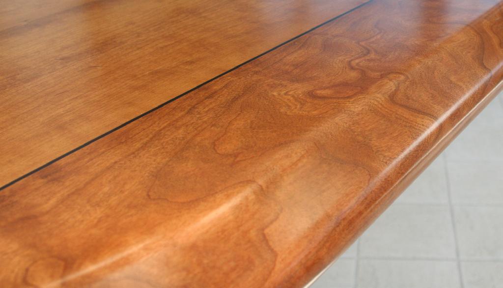 Solid Cherry Base with Leveling Feet The base of the table is made of solid cherry hardwood.