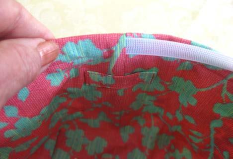 2. From the inside of the cuff, insert the boning into the 5/8 inch opening made when sewing the back seam of the bag. Push the boning through the casing, taking care not to crease or crimp it.
