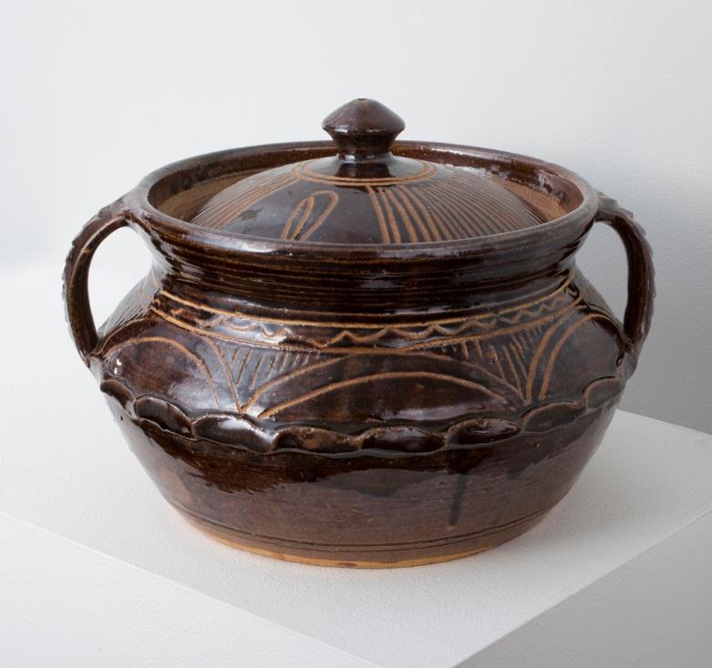 Gwari Casserole and Cover 1939-83 Stoneware Brown glaze with incised wavy lines, pie-crust band and domed