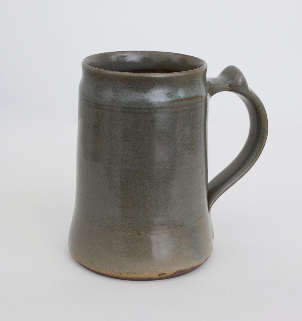 Tankard 1945-48 Cylindrical form with dark grey glaze, looped handle