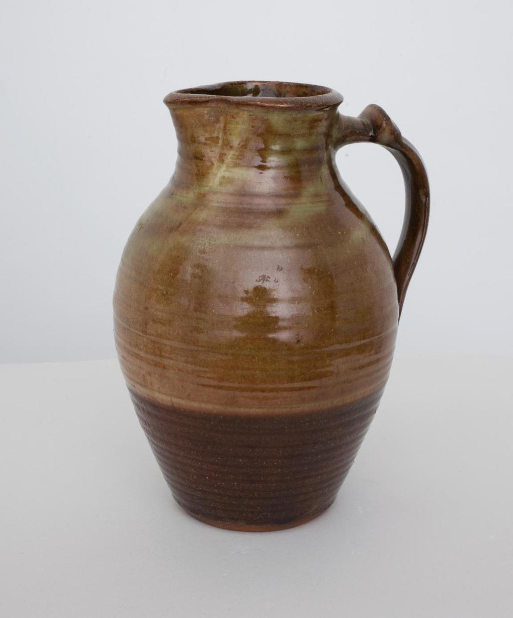 Jug with Handle 1926-42 Brown and green glaze, bulbous body, cylindrical neck,