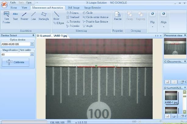 To calibrate an objective lens: Firstly, take a photo with a reference ruler and open the photo with the software.