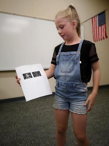 Evelyn, a fourth grader, loves history and math. She was curious about robotics activities, and she joined Team 2014P.