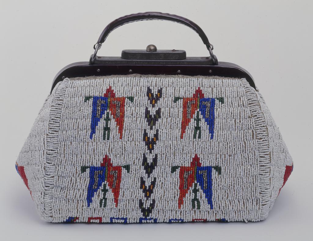 The purse she holds is a Western doctor s bag that has been decorated with glass beads. Doctors bags were used by physicians in the 1800s to make house calls on their patients.