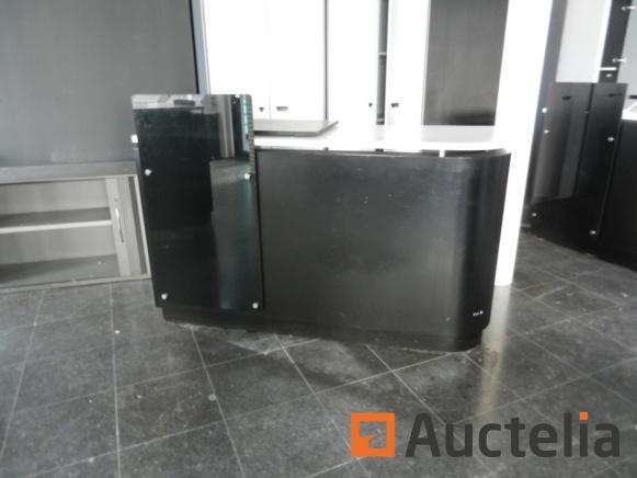 Dismantling by the buyer Location: Ground floor ID : 1022-002 Sales counter Sales counters Black lacquered wood and gray tablet Presentation face in smoked glass on the right 2 drawers with hanging