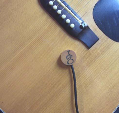 AT-1 - Acoustic Transducer Pickup Best way to amplify just about anything that vibrates Designed to pick up vibrations from any acoustic soundboard be it on a classical guitar, violin, harp or even a