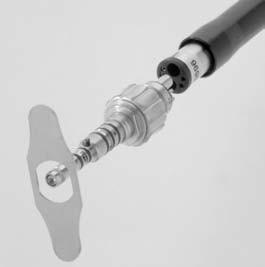 CONNECTING HANDPIECE TO SWIVEL COUPLER 1. Lubricate the handpiece. 2. Attach the coupler to the dental unit hose securely. A. Align pins on the coupler with the tubing. B.