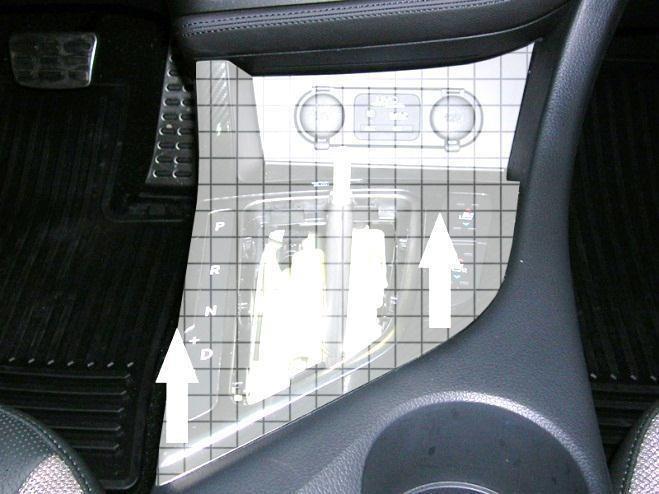 edge of the center console (if you do this, lay a shirt or cover over the center console to