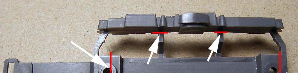 Cut through the bogie in the places indicated by the white arrows and as close to the red
