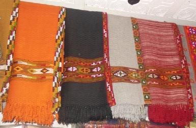 facilities to weavers and other artisans, production in workshops, marketing of handloom and