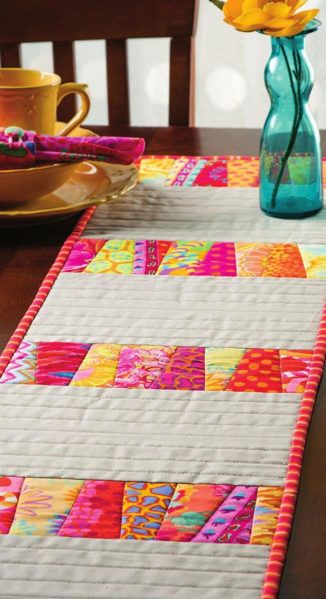 3 Color Me Happy Table Set Designed & Quilted by Chris Malone Turn your favorite strips of fabric into gorgeous accents with this unique table set. One table set won t be enough.