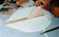 Turn the Platter over and using a butter knife to insert the tape into the gap so that is touch the other tape. Carefully work out the tape from the gap. Step 5 - The Rudder.