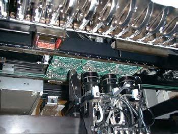 These machines are often called pick and place machines. The components are loaded into the machines in reels, as can be seen in the diagram on the right.