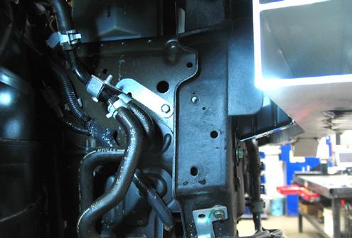 6. To remove middle belly pan, remove 8 bolts using a 10MM socket and a push pin with a flat