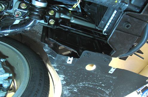 On the sway bar, passenger side, remove the front outside hex nut
