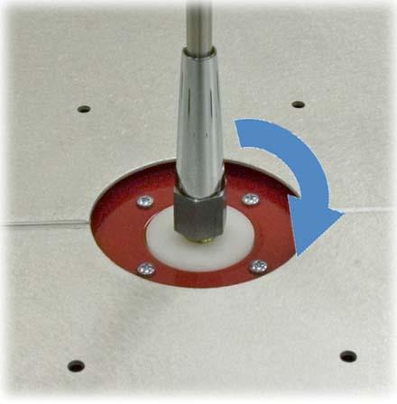 8. Insert the monopole through the hole in the counterpoise and into the antenna base. Rotate the monopole to tighten. 9.