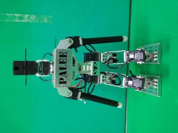 Each robot uses 20 servo-motors (details are provided in the robot specification sheet). Fig. 1. Shown striker robot (Left) and goalie robot (Right). All striker robots use the same set of sensors.