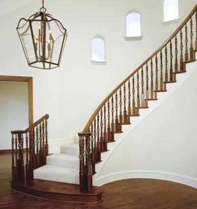 A. New Englander A graceful, right hand, curved stair featuring a full wood balustrade on 11 2 sides (open 2 treads on the outside radius).