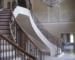 This stair features a solid oak, pin top balustrade with volutes on both sides of the double starting step. B.