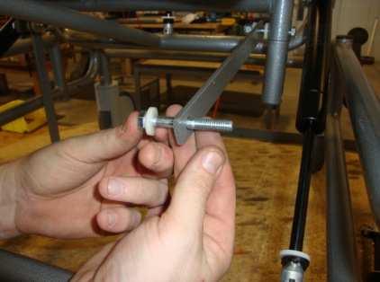 9 Install a #1 nylon spacer onto the hex cap screw.