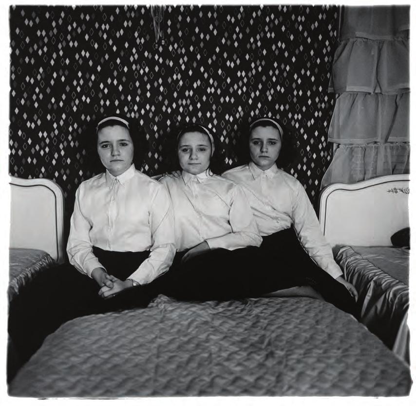 Diane Arbus (1923-1971) Triplets in their bedroom, N.J.