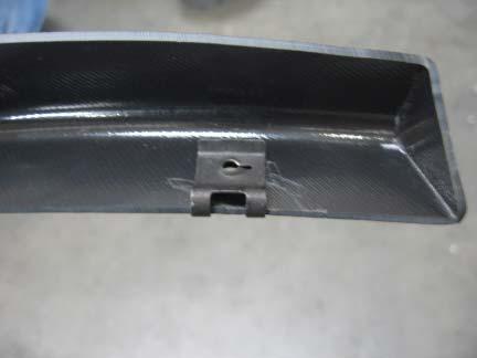 Remove two fender inner liner factory screws with a 7/32 socket wrench.