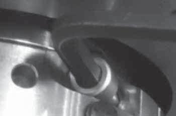 Use hex wrench and alternately tighten holder cap screws (refer