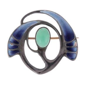 THEODOR FAHRNER - an enamel brooch. Designed as a stylised leaf shape, with purple to blue graduated enamel to either side and a green gem collet-set to the centre. With maker's marks.