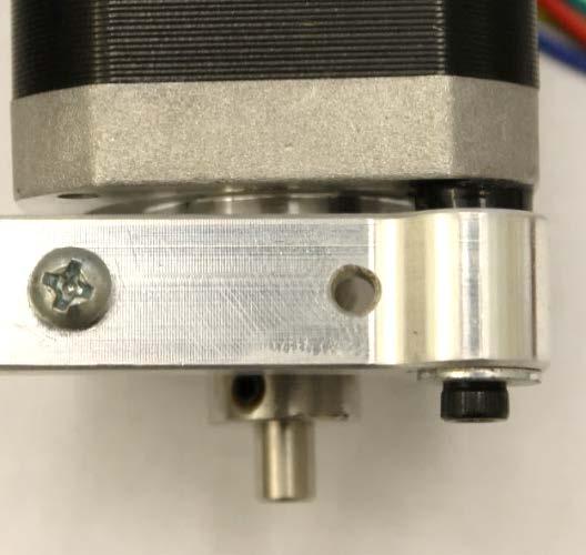 Mount the extruder arm onto the extruder motor with one washer spaced between the M3 20 mm