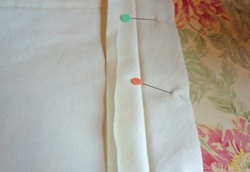 Place the two ties vertically and side by side on your work surface.