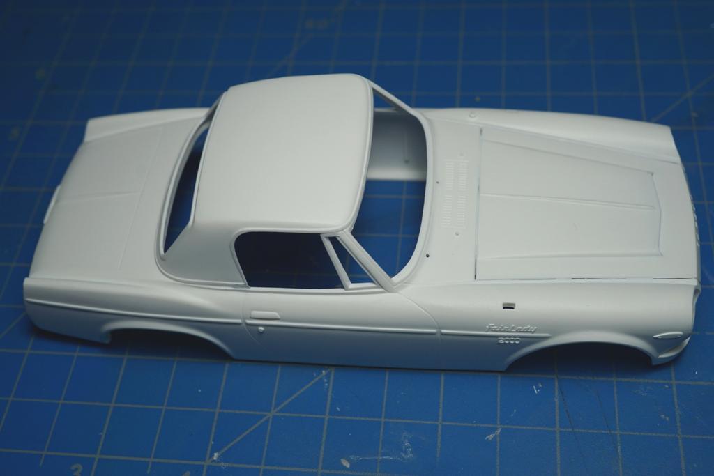 Turning my attention to the body, I had glued the hardtop on, sanded away the molding seams and washed the