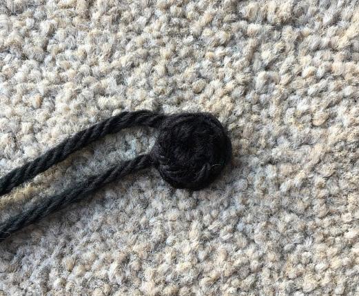 Using the Chinchilla yarn, work a dc stitch into each leftover front loop working in a continuous spiral around and around the tail (see Photo 6).