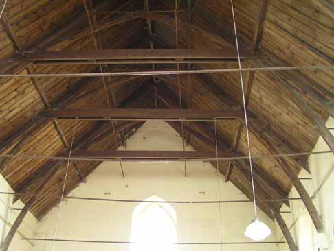 The roof structure Figure 9 roof structure looking west The roof is divided into seven bays by six softwood trusses linked by two series of side purlins and a ridge purlin.