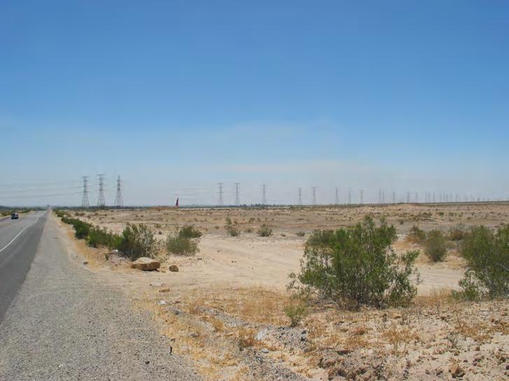 View from KOP #1 (SR-98) looking east towards transmission line corridor. This view shows BLM lands and existing transmission towers in the distance.