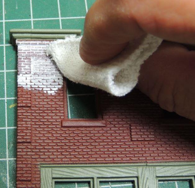 We sprayed ours, so the brick was masked off then we painted the storefront with Model Master