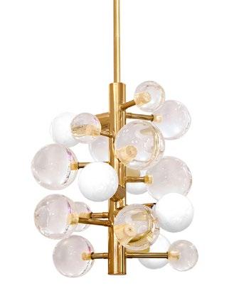 75 H Min drop: 24, Max drop: 48 ELECTRUM KINETIC CHANDELIER Polished brass and polished nickel rings surrounding a white milk glass shade with brass banding 28 Dia.