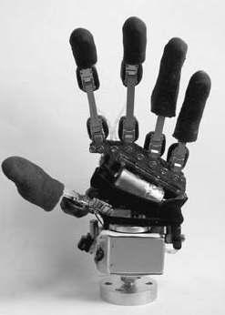 The hand has 14 mechanical joints and 10 D.O.F.s (one D.O.F. is eliminated by coupling the medial and distal phalanxes through a four bar link mechanism).