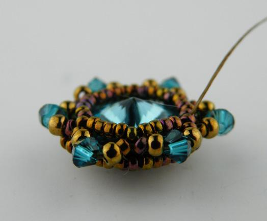 Row 5: String 3 size 15 beads and then pass through the bead the thread is exiting from on the opposite side to create a picot on top of the existing picot from the last row.