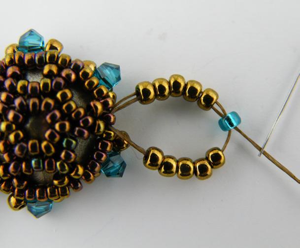 (Photo 22) Necklace: The components in the necklace are connected the same way as the bracelet just in a V pattern instead of in a straight line.