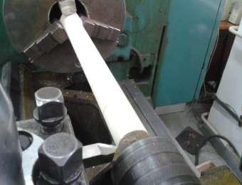 being clamped in the workpiece holder and the dead centre of the tailstock (Fig. 1).