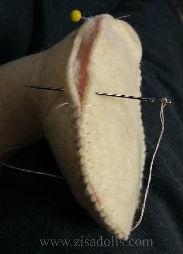 its leg and start to sew closed.