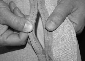 zipper apart as shown in the picture to the