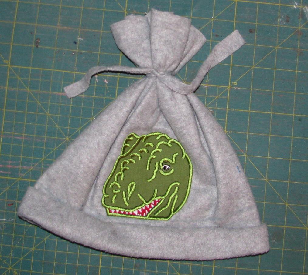 Step 11. Cut the little tie pieces the same length as the top of the hat.