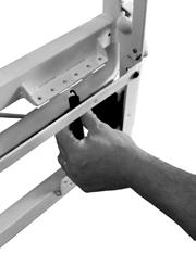 Section 4: L SSMBLY 11. Stand the assembled frame. Lift and set the hinge Photo 1 etail - not full scale axles of the ead Frame (B) into the hinges of the Yoke ssembly. inside of frame () 12.