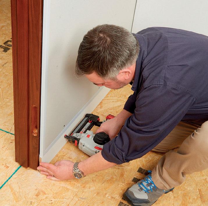 Lift drywall to baseboard height using a block for support.